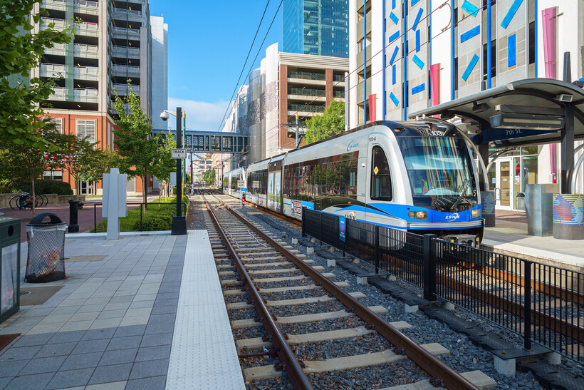 Charlotte’s light rail train arriving at Seventh Street Station in Uptown. - moving to Charlotte NC