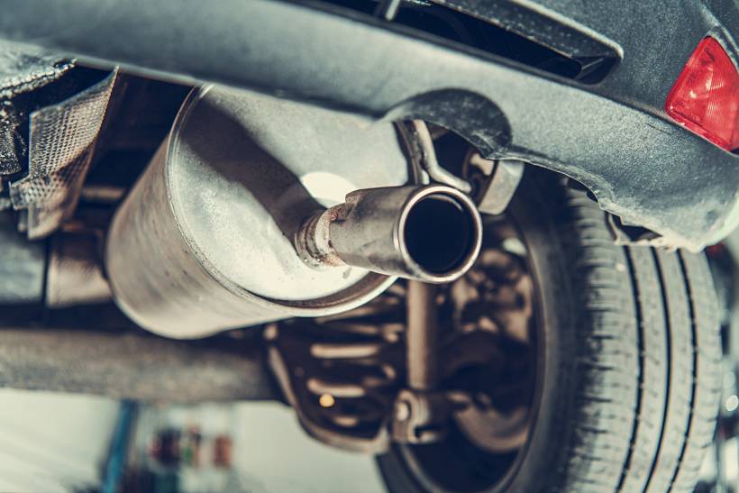 diesel particulate filter replacement cost - Close-up of vehicle exhaust pipe and muffler